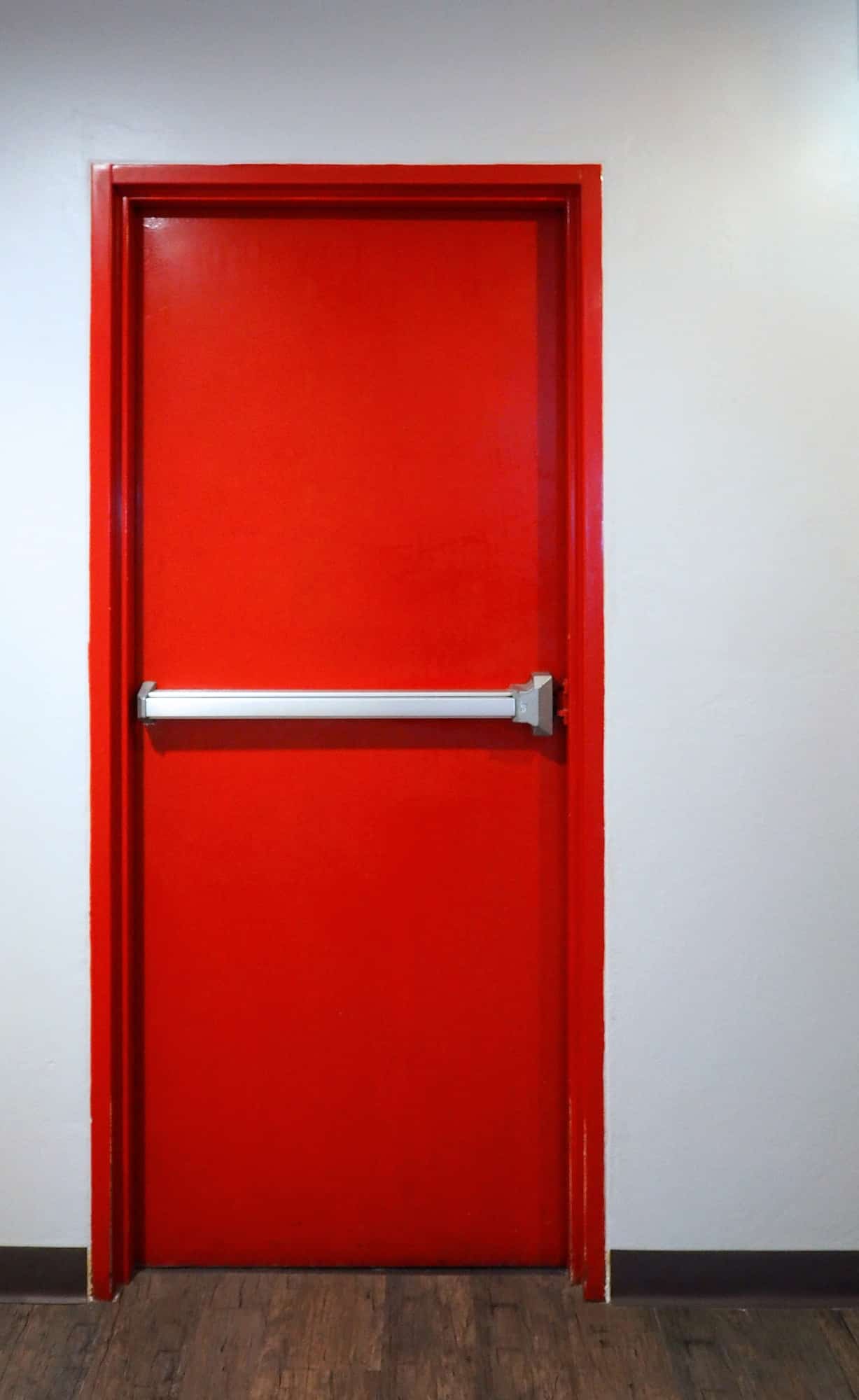 Emergency fire exit door red color.